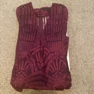 Very long dress a little bit see through. It purple with a pattern.